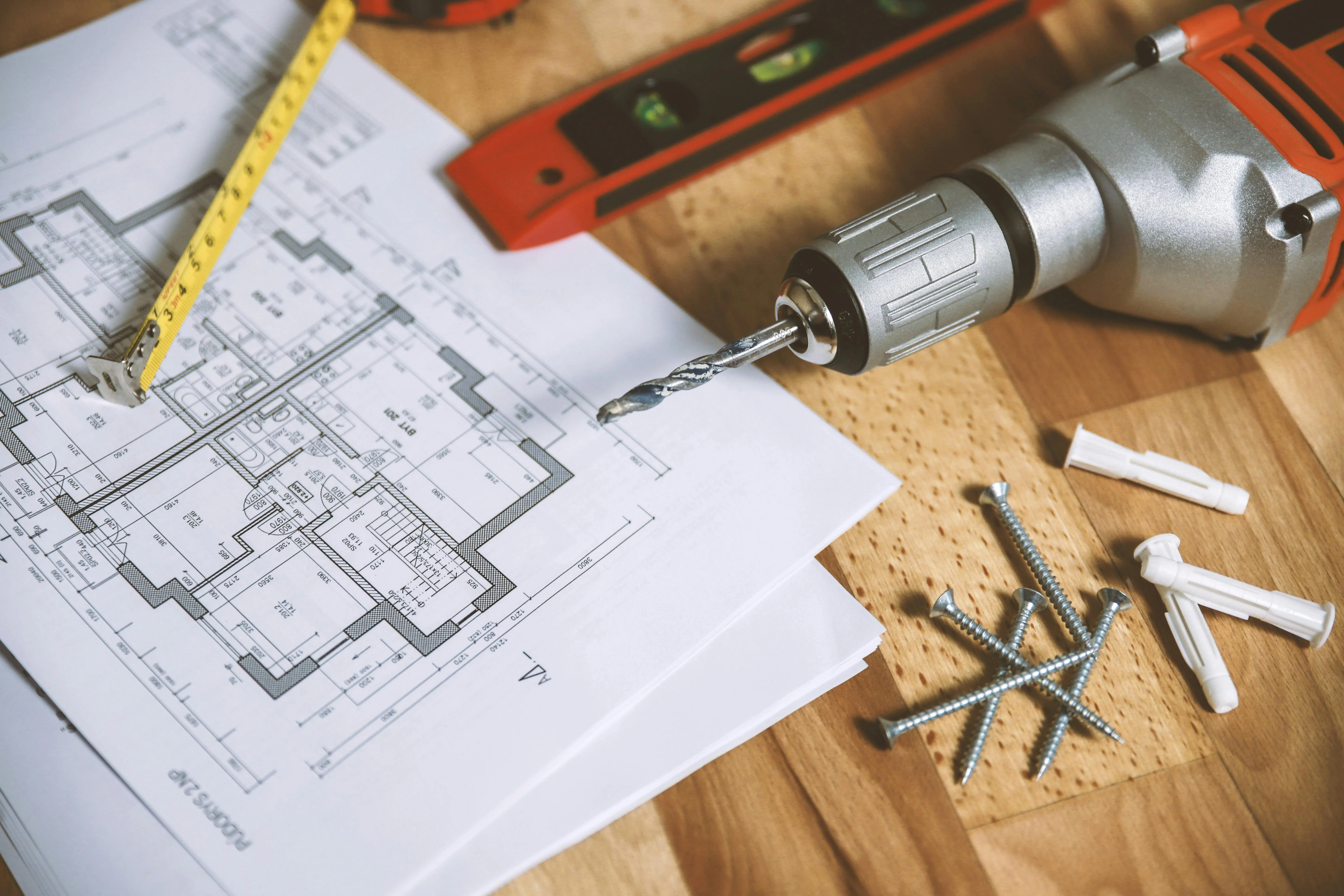 Two professionals reviewing blueprints
